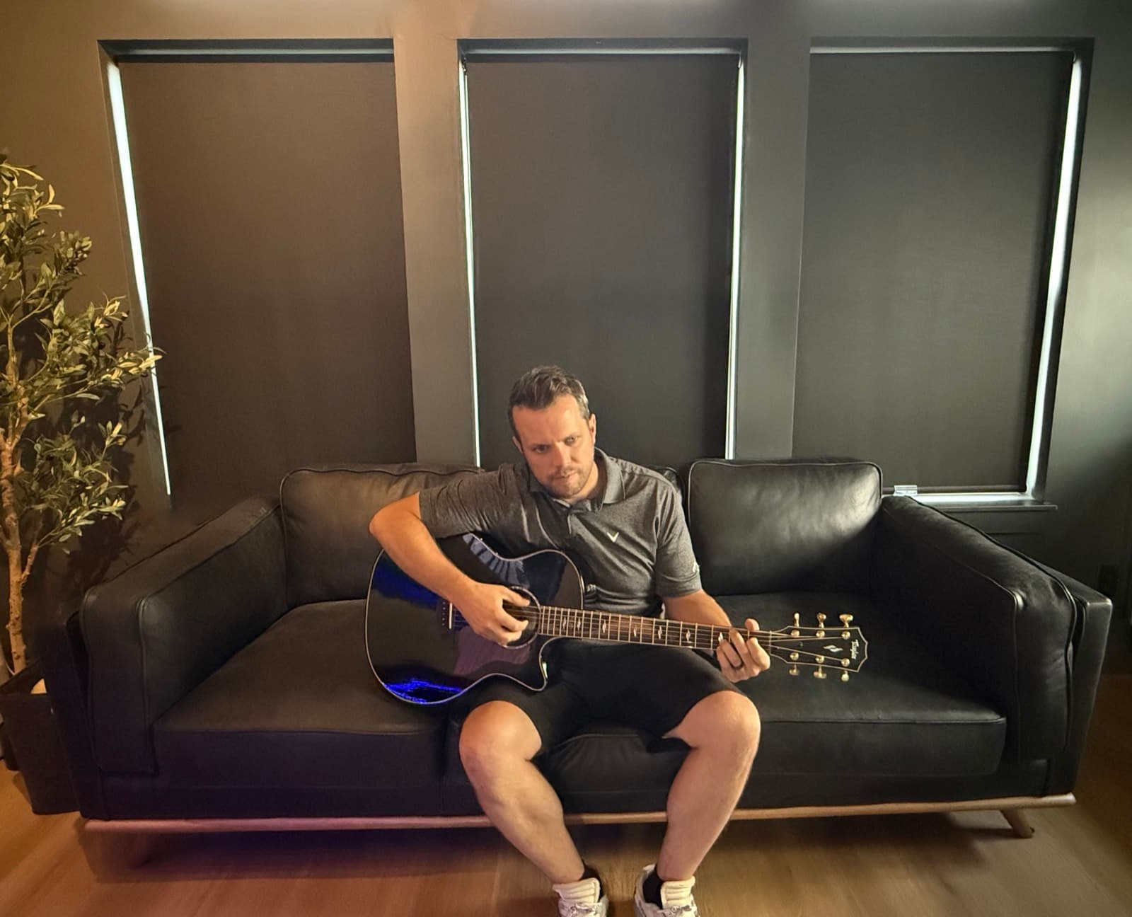 Playing guitar in the studio